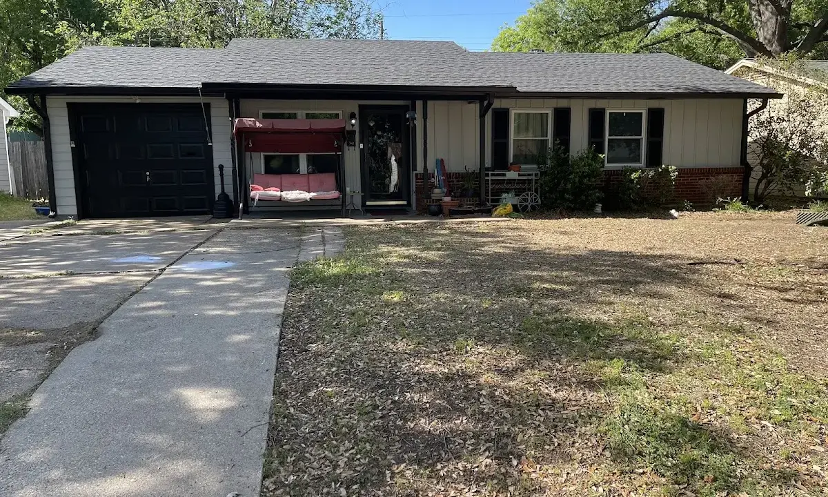 Asphalt Shingle Roof Repair crew at work on a residential roof in Brooksville